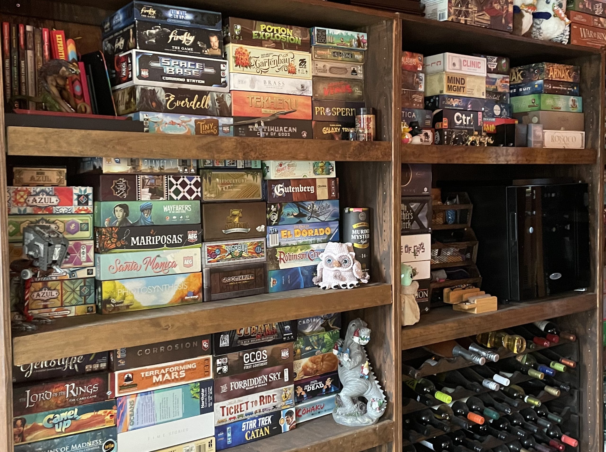 Dark shelves stacked full of board games